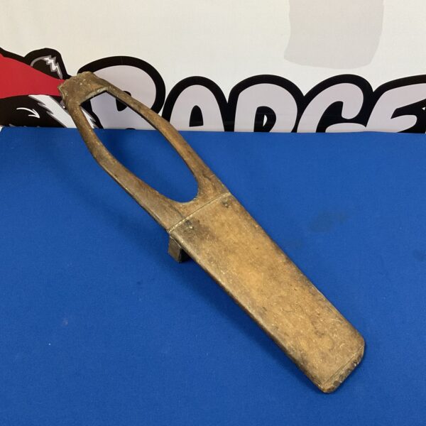Antique oak boot jack for removing boots, vintage farmhouse style.