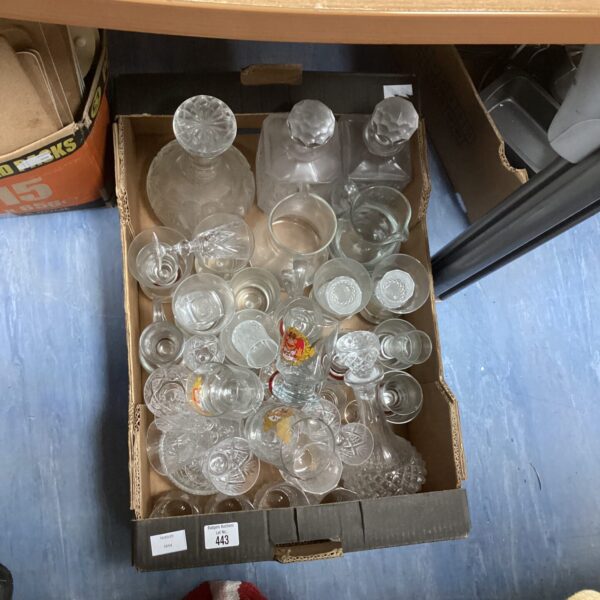 Assorted mixed glassware lot with vintage bottles and decorative glass.