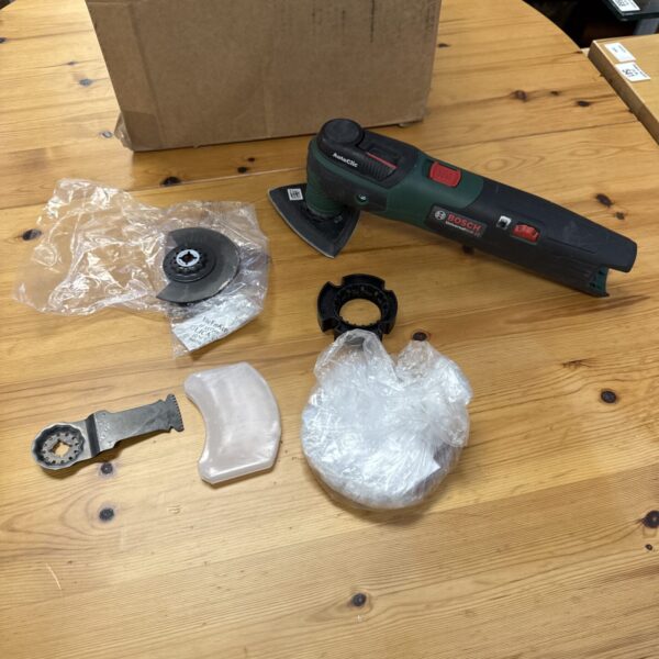 Bosch UniversalMulti 12 multi tool with included accessories.