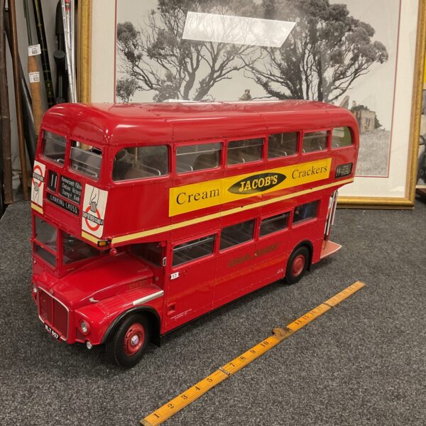 Red Routemaster bus model with detailed signage.