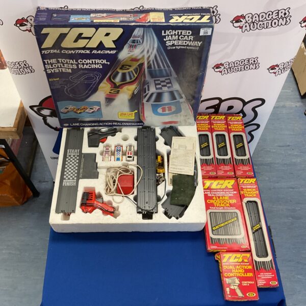 Vintage Ideal TCR Total Control Racing set with controller and track pieces.