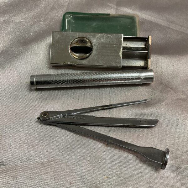 Vintage Donatus Solingen cigar cutter and pipe tamper tool.