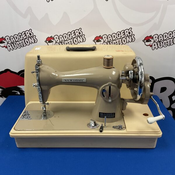 Vintage New Home sewing machine, antique collectible for restoration.