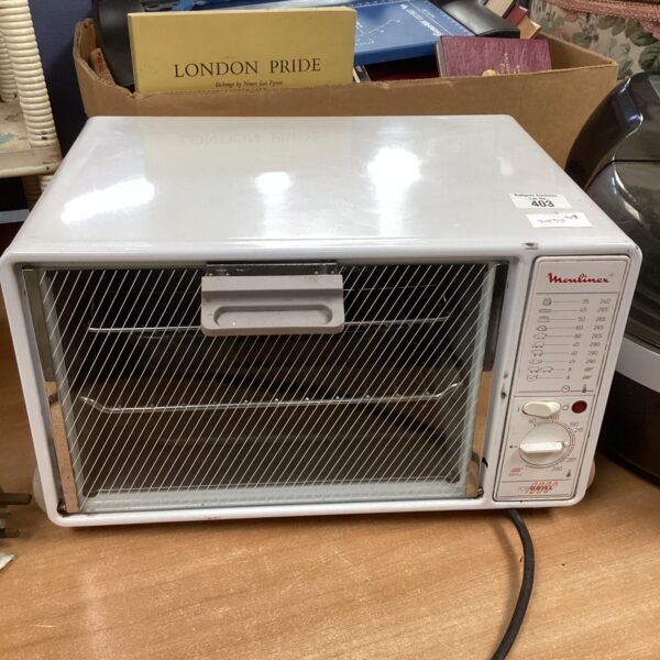 Vintage Moulinex portable oven on a countertop.