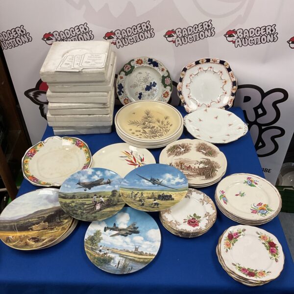Large lot of Bradford Exchange collectors plates for display.