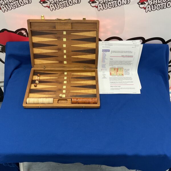 Open vintage backgammon set with pieces and dice.
