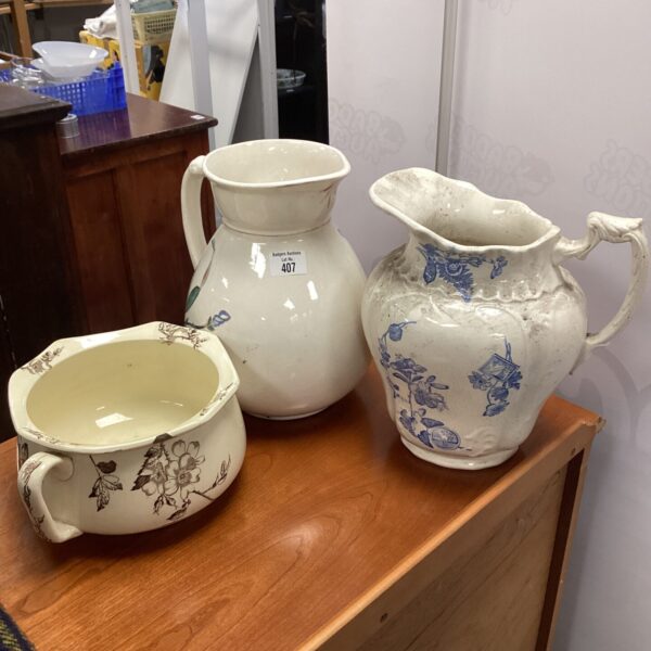 Antique ceramic water pitcher with blue transfer print.