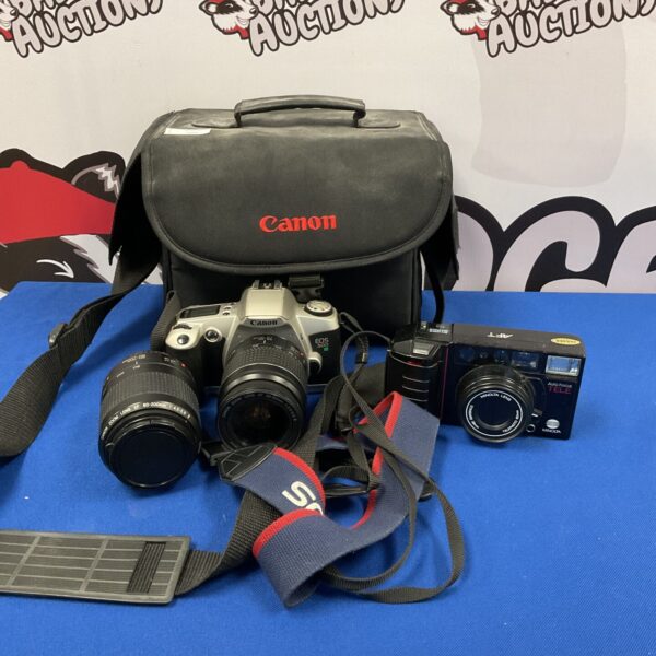 Vintage Canon EOS 500N and Minolta AFT camera bundle in a bag.