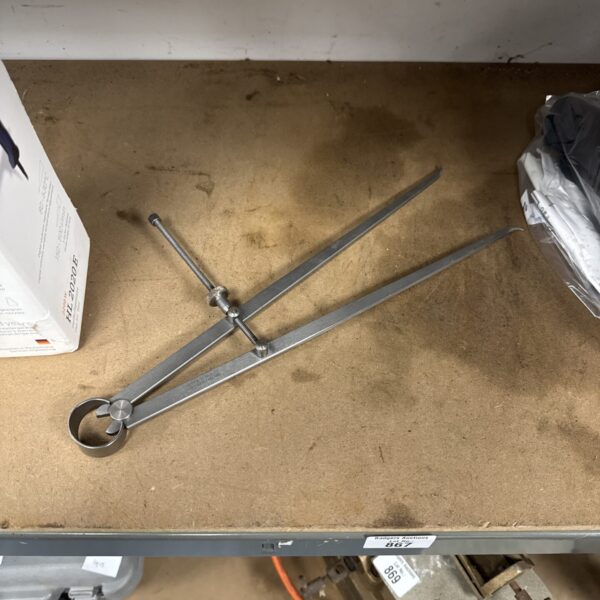 Large Moore & Wright internal calipers for accurate measurement.