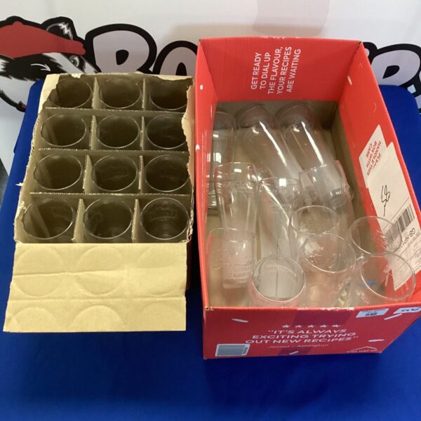 Two boxes of Stella Artois and Rekorderlig branded pint glasses.