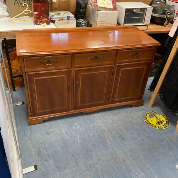 Vintage cherry wood sideboard with brass handles for hall or dining room.
