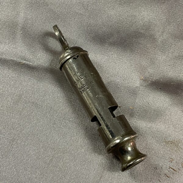 Vintage brass Acme City Police whistle, collectible memorabilia.