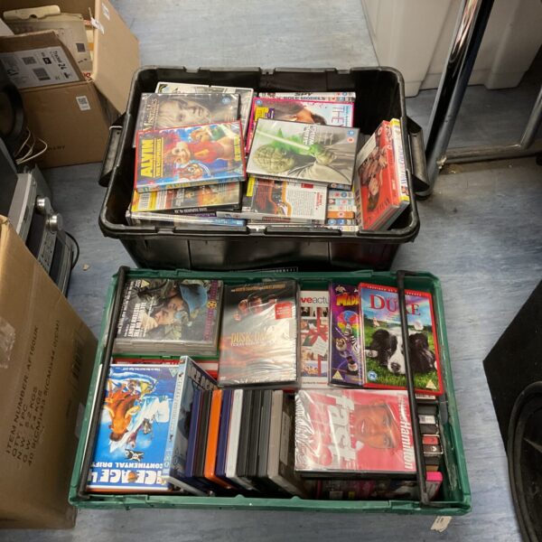 Two boxes filled with a large DVD collection for home entertainment.