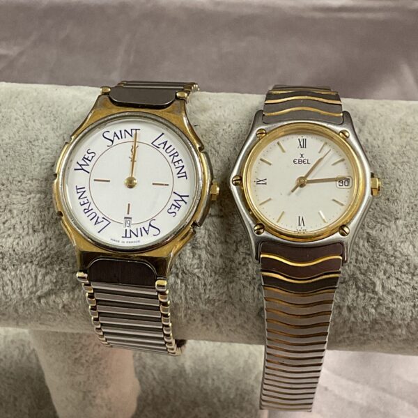 Gold-tone Yves Saint Laurent watch with textured dial.