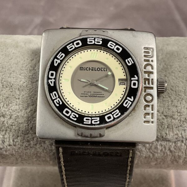 Vintage Michelotti automatic wristwatch with a square case and unique dial.
