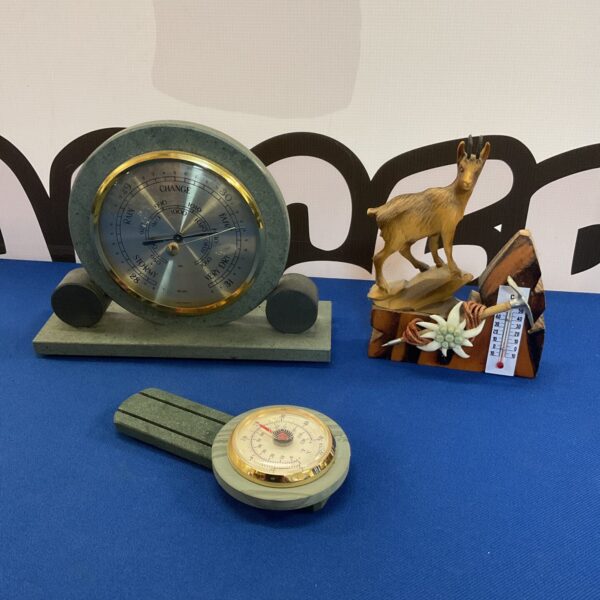 Vintage German slate barometer and thermometer for weather monitoring.