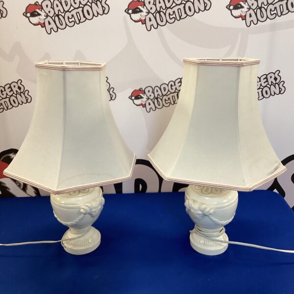 Pair of vintage rams head table lamps with urn bases.