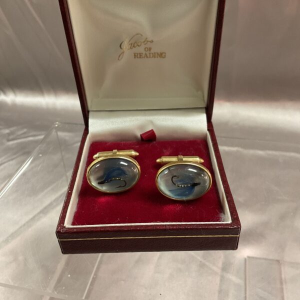 Vintage fly fishing cufflinks with blue enamel detail.