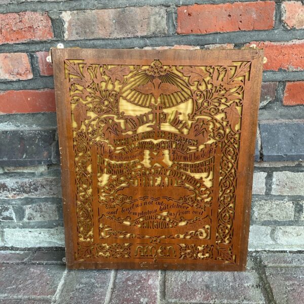 Vintage carved wooden panel featuring the Lord's Prayer.