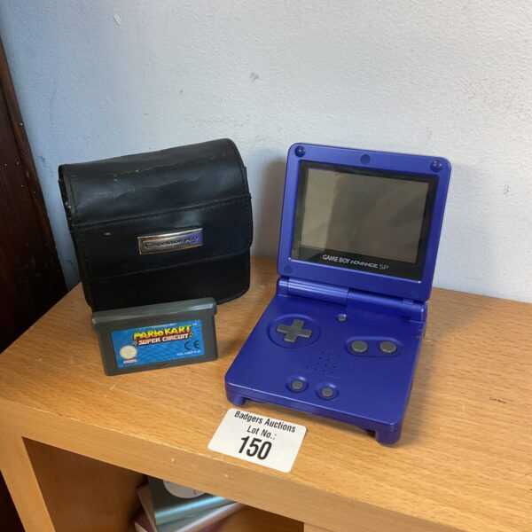 Blue Nintendo Game Boy Advance SP with Mario Kart game.