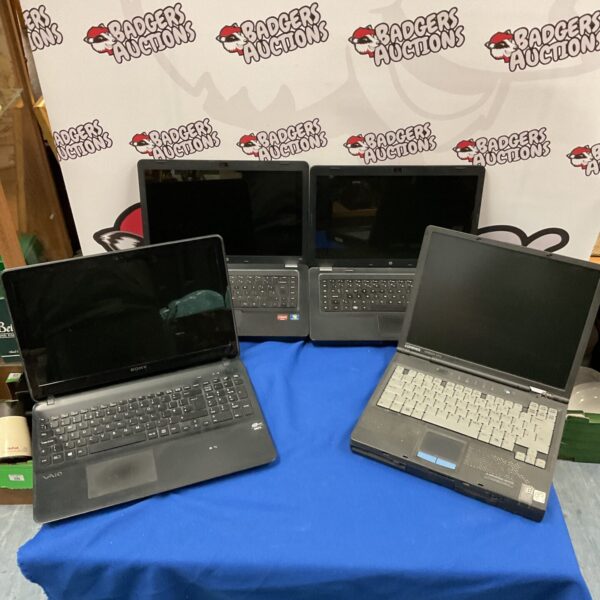 Lot of four vintage laptops including Sony and Compaq models.