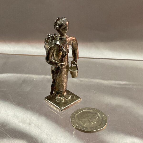 Antique silver holy man figurine, detailed oriental religious sculpture.
