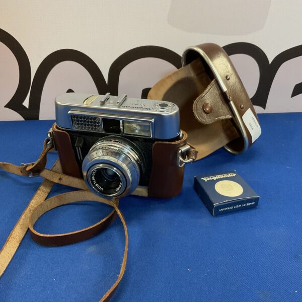 Vintage Voigtlander Vito CL camera with lens visible.