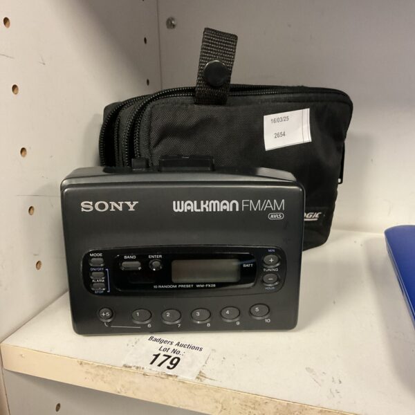 Sony WM-FX28 Walkman with original case, vintage cassette player.