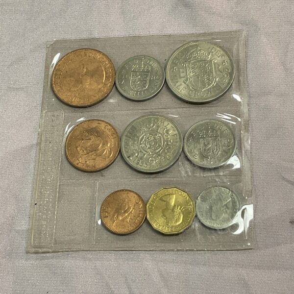 Sealed sleeve of uncirculated 1953 British coins for collectors.