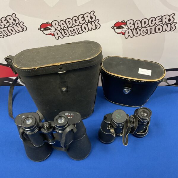 Vintage binoculars pair with cases, including Pathescope 30x70 model.