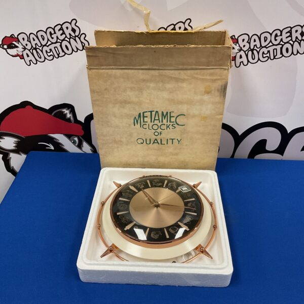 Vintage Metamec zodiac clock with zodiac signs around the dial.