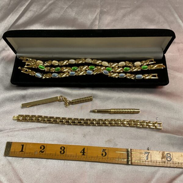 Vintage bracelet and tie clip lot with faux gemstones.