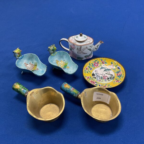 Vibrant enamel miniature collection with teapot and figures.