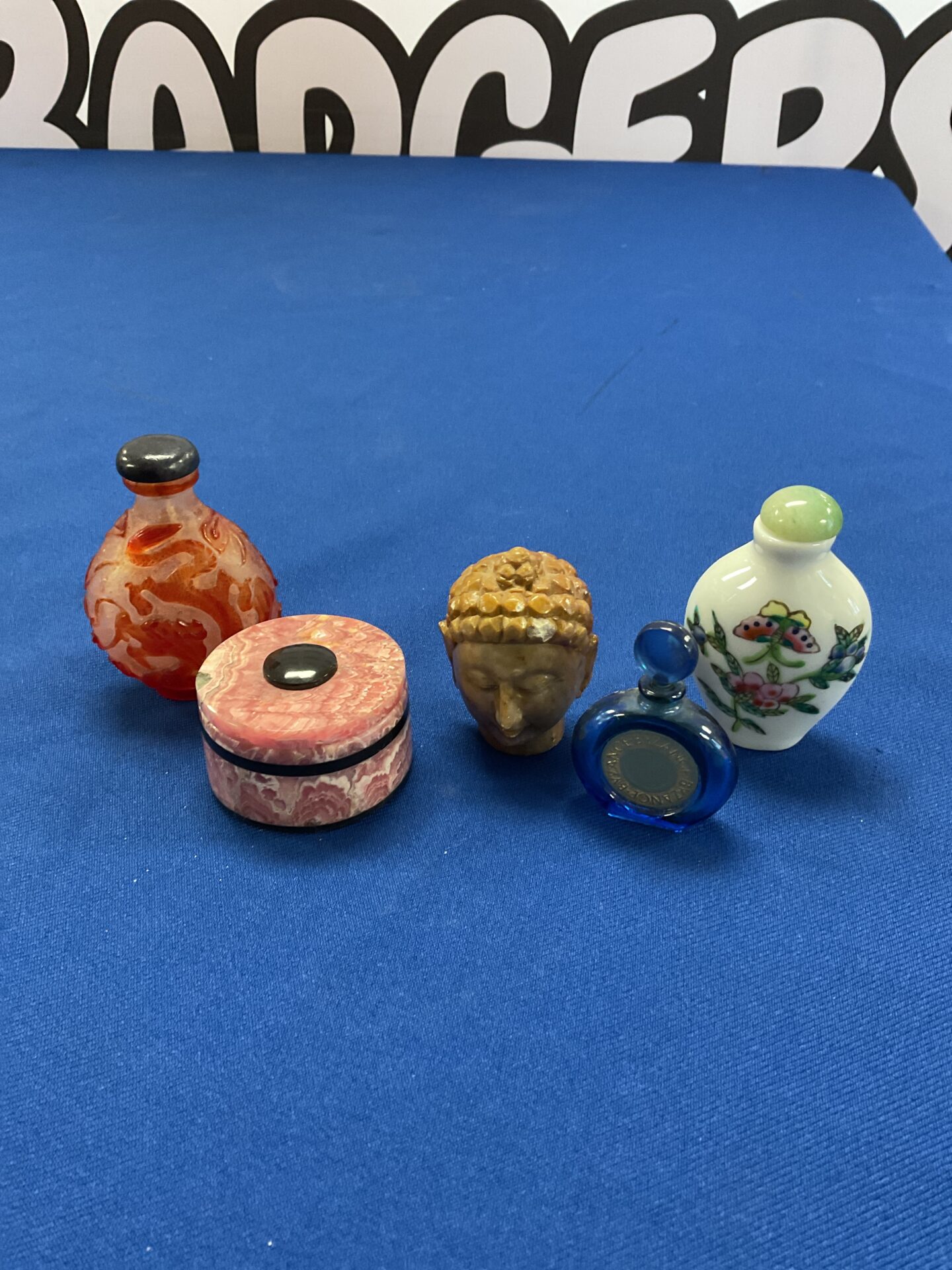 209 Three oriental scent bottles & stone buddha head & pot