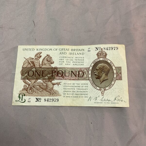 Front of a vintage George V one pound note with portrait.