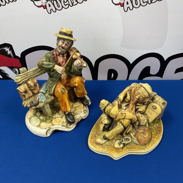 Vintage Capodimonte figurines of a violinist and hobo, detailed porcelain.