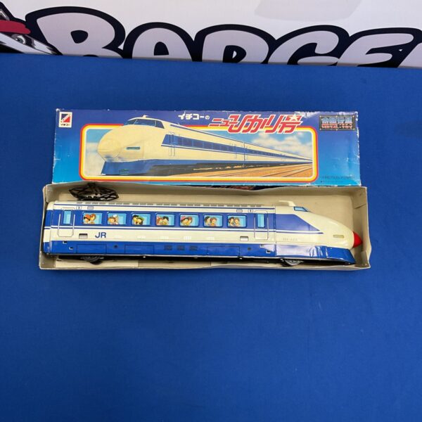 Vintage Japanese Ichiko tin train with friction power mechanism.