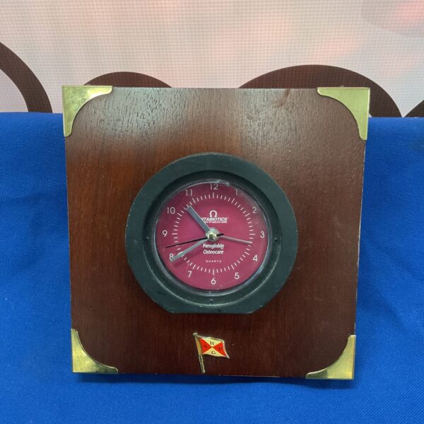 Front view of a vintage Vintabotics quartz clock.