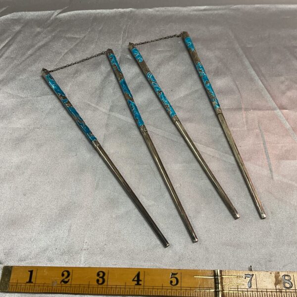 Vintage silver enamel chopsticks with floral designs.