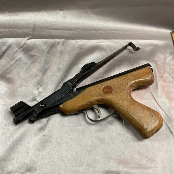 Vintage Diana MK IV .177 air pistol with wooden grip.