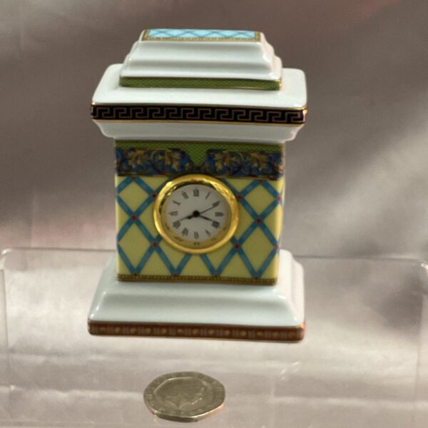 Front view of a Rosenthal Versace desk clock with a patterned design.