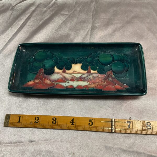 Vintage Moorcroft pen tray with vibrant floral design.