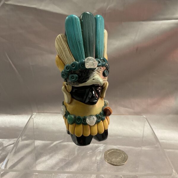 Front view of an Aztec Mayan idol statue crafted from obsidian.