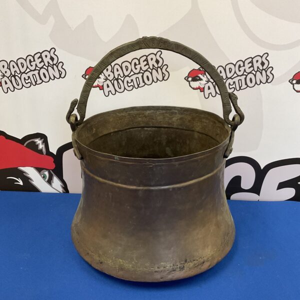 Antique copper bucket with a sturdy brass handle, vintage style.