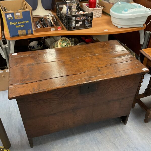 Front view of an 18th-century oak coffer with visible grain.