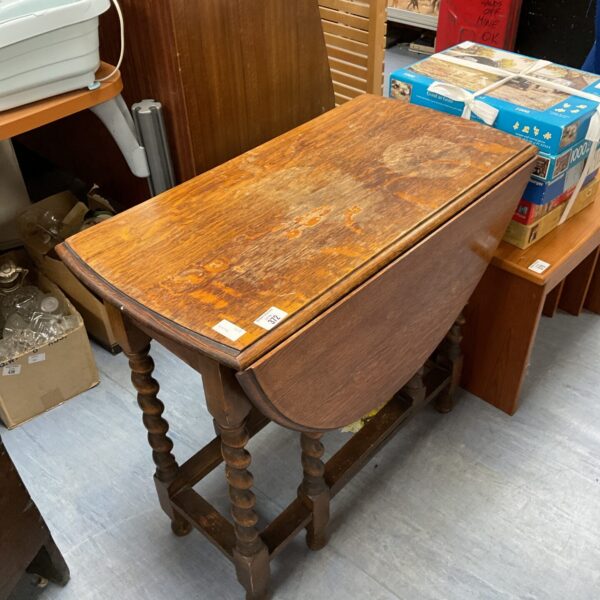 Antique oak gate leg table with barley twist legs and drop leaf.