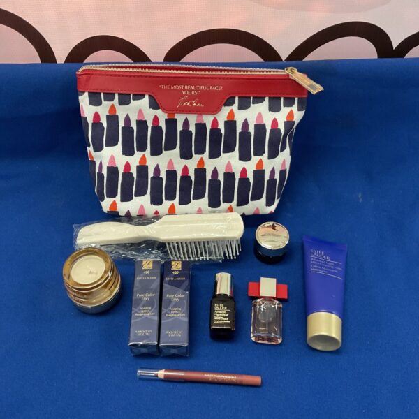 Estee Lauder makeup lot with red polka dot bag and cosmetics.