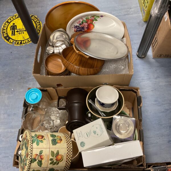 Overview of a mixed china and cookware lot with various dishes and pots.
