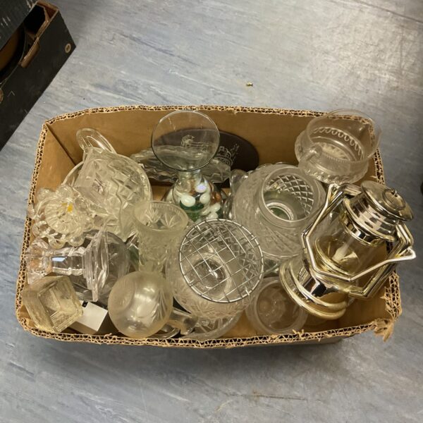 Assorted vintage crystal and glassware collection on display.