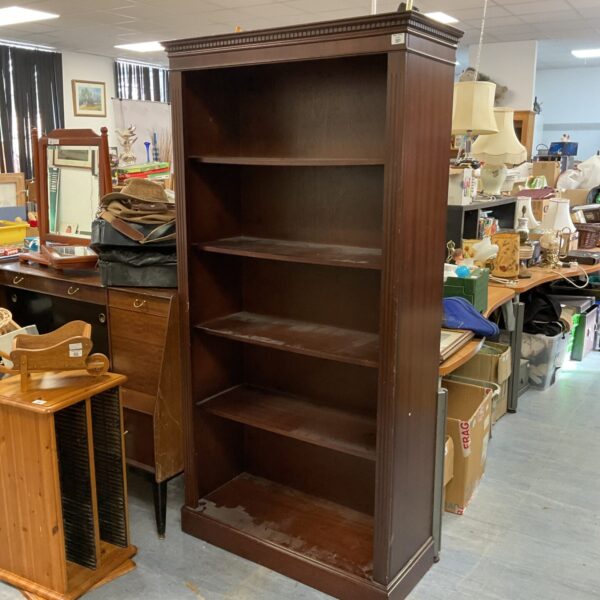 Large mahogany effect bookcase with multiple shelves for storage.